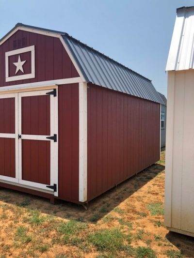 A red and white 10x16 Lofted Barn with a star on it is available for sale.