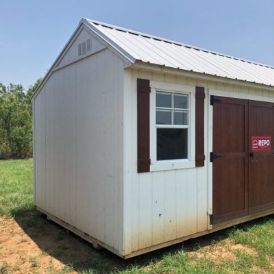 A 10x16 Garden Shed for sale near me, sitting in a field.