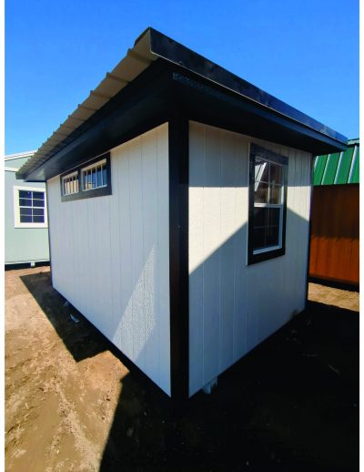 For sale: A 8x12 Studio Shed with a black roof.