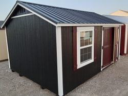 A 12x16 Utility Shed with a red roof available for sale.