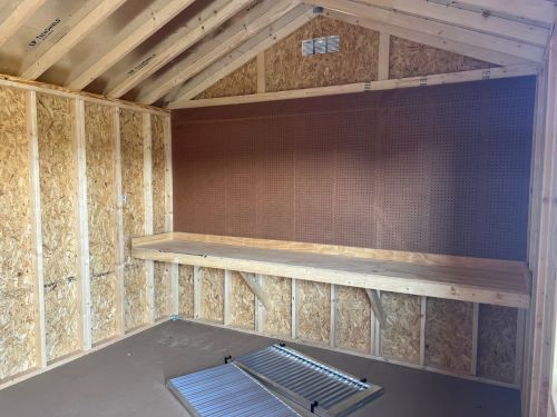 garage shed interior with shelf and ramps